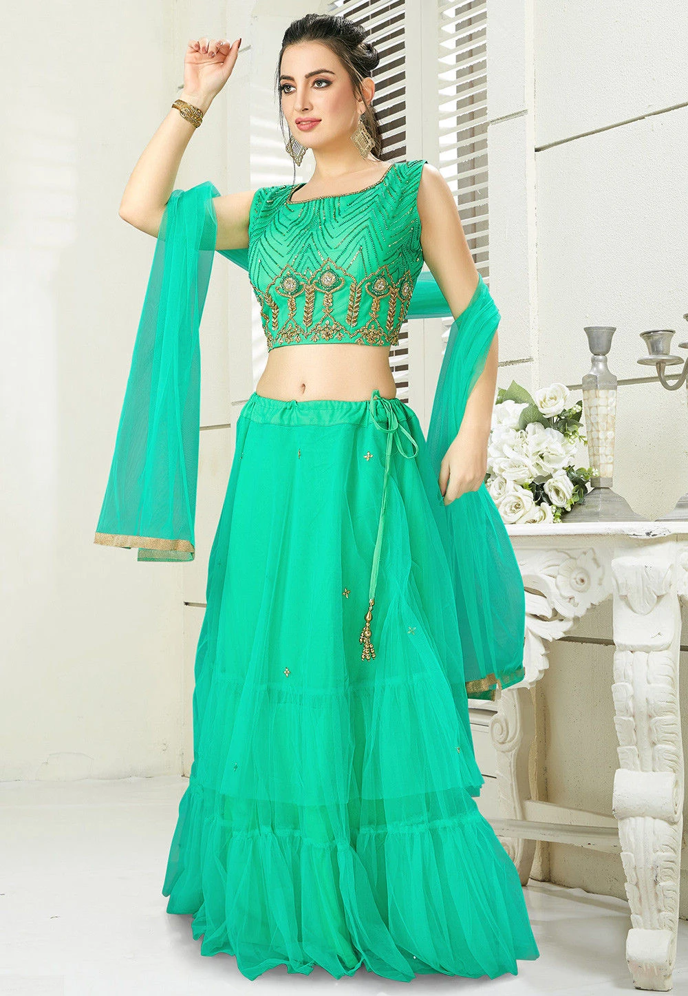 Hand Embroidered Net Lehenga in Teal Green